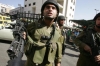 An_Israeli_soldier_points_his_gun_at_Nayef_Hashlamoun,_October_25,_2007.jpg